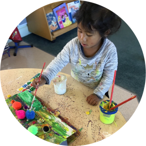 Painting time - Papakura Early Learning Centre